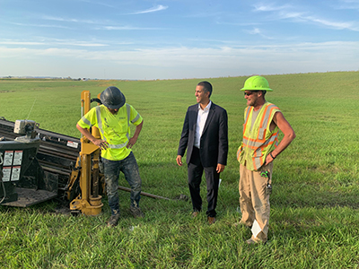 Chairman Pai meets with workers who are trenching fiber under a highway in North Dakota. Click for full size image.
